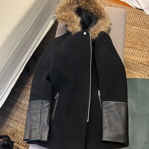 Sandro black jacket with leather sleeves and faux fur hood